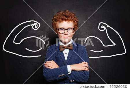 Happy successful redhead child boy playing Happy successful redhead child boy playing 55526088