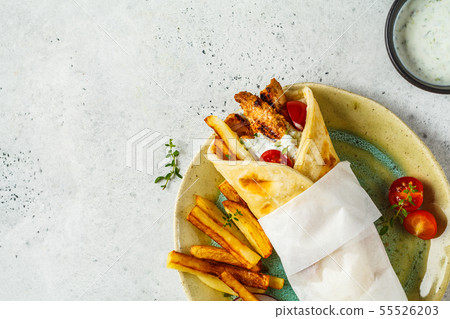Gyros souvlaki wraps in pita bread with chicken Gyros souvlaki wraps in pita bread with chicken 55526203