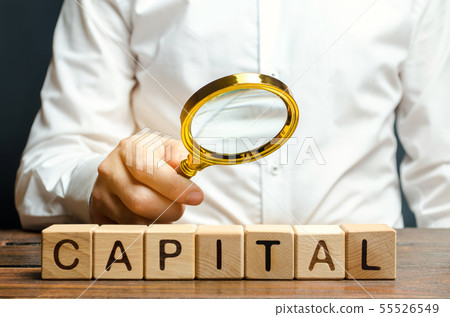Businessman exploring the origin of capital. Businessman exploring the origin of capital. 55526549