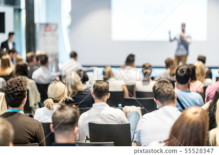Male business speaker giving a talk at business conference event. 55528347