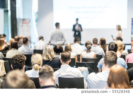 Male business speaker giving a talk at business conference event. Male business speaker giving a talk at business conference event. 55528348