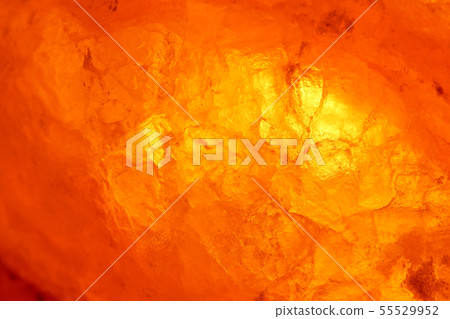 Close-up rock salt lamp that emits meditative light 55529952