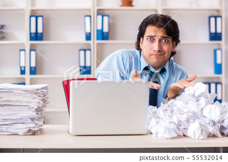 Businessman rejecting new ideas with lots of papers Businessman rejecting new ideas with lots of papers 55532014