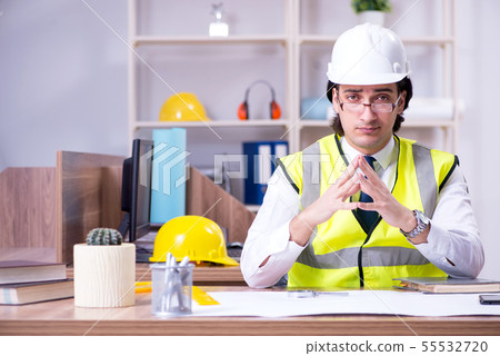 Young male architect working in the office Young male architect working in the office 55532720