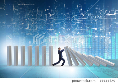 Businessman preventing domino effect in business concept 55534129