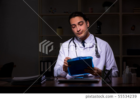 Young male doctor in the hospital at night 55534239