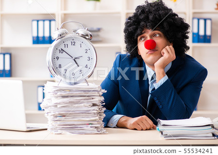 Young clown businessman working in the office 55534241