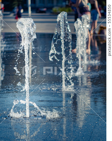 Water streams of dry fountain on main city square 55534850