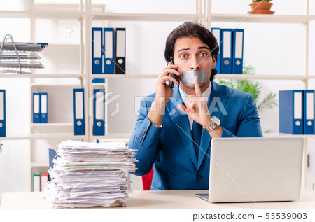 Young male employee with tape on the mouth 55539003