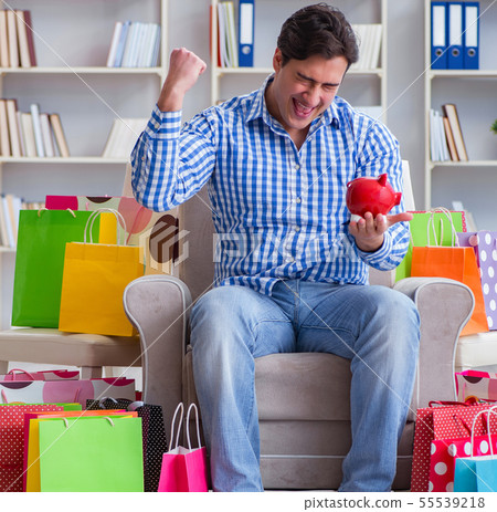 Young man after excessive shopping at home 55539218