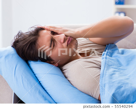 Man suffering from insonmia in bed at home 55540294