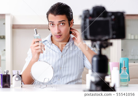Young handsome man recording his blog in hygiene concept Young handsome man recording his blog in hygiene concept 55541056