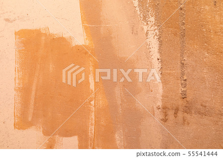 An orange unevenly painted beton wall An orange unevenly painted beton wall 55541444