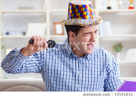 Funny man singing songs in karaoke at home Funny man singing songs in karaoke at home 55541833