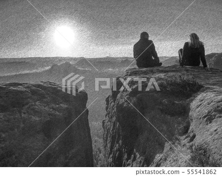 Couple tourists take rest at edge with  background 55541862