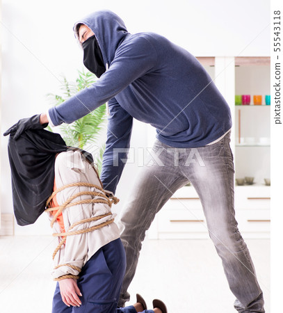 Armed man assaulting young woman at home 55543118