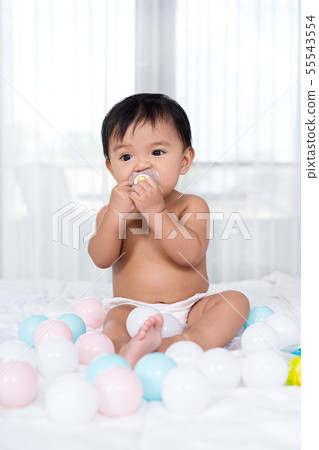baby sitting on bed baby sitting on bed 55543554