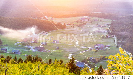 Jizerka village at sunset time. View from Bukovec Mountain, Jizera Mountains, Czech Republic 55543907