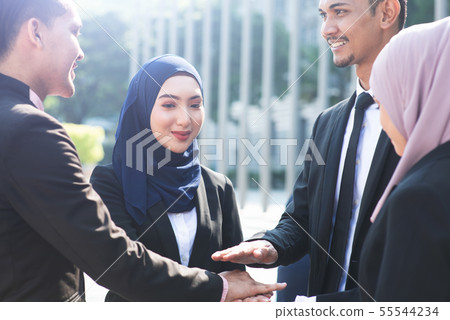 Business people stacking hands 55544234
