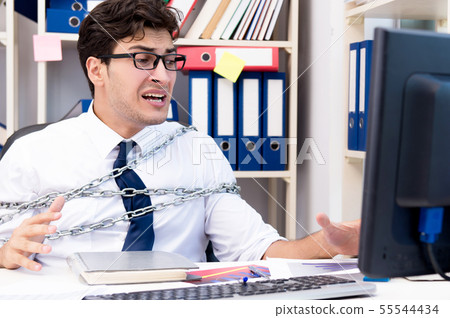 Employee attached and chained to his desk with chain 55544434