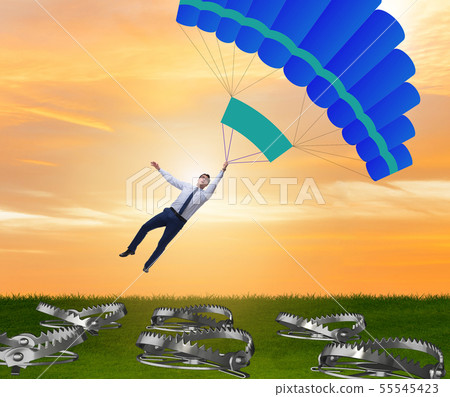 Businessman falling into trap on parachute 55545423