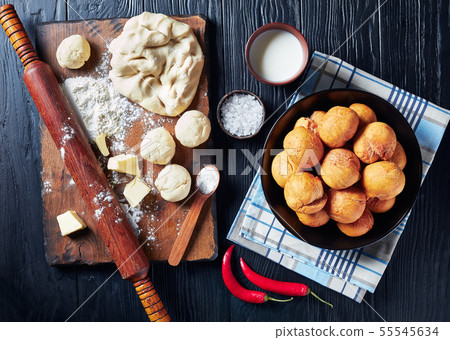 Caribbean fried dumplings in a black bowl 55545634