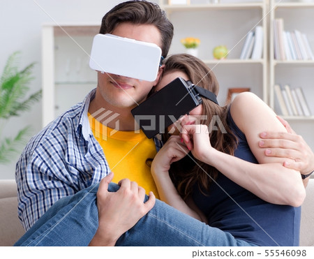 Young family playing games with virtual reality glasses Young family playing games with virtual reality glasses 55546098