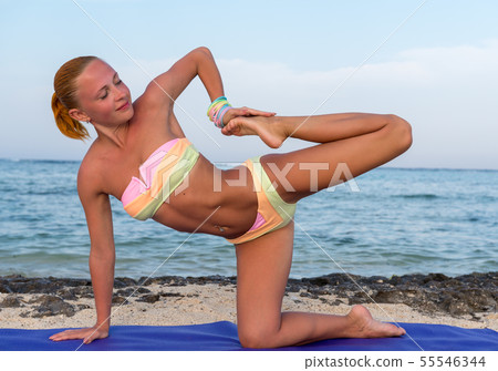 Woman doing yoga 55546344