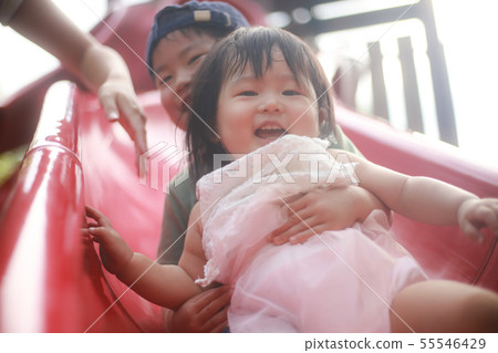 Children playing on the slide 55546429