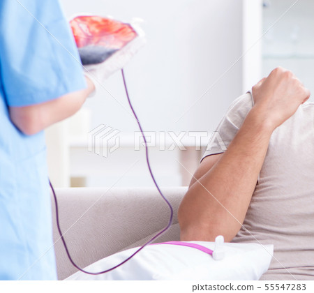 Patient getting blood transfusion in hospital clinic 55547283