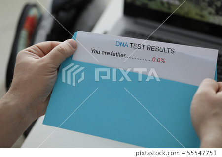 Male hands holding blue envelope with Male hands holding blue envelope with 55547751
