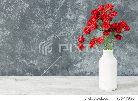 Roses on wood table  55547956