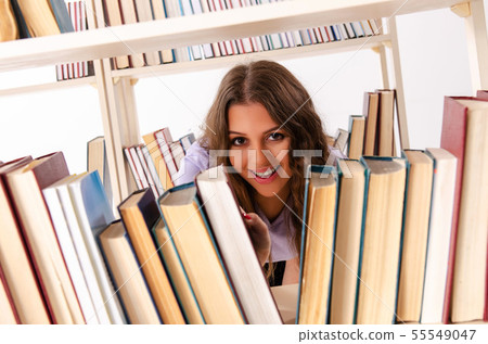 Young female student preparing for exams at library 55549047
