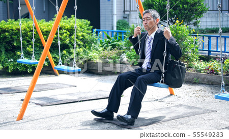 Mature man on a swing 55549283