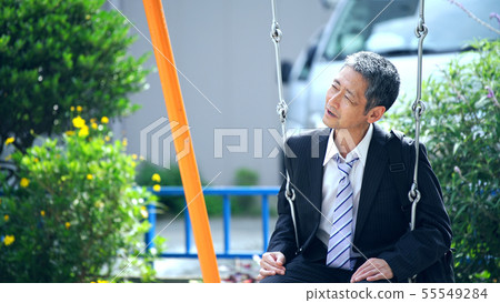 Mature man on a swing Mature man on a swing 55549284