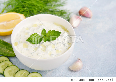 Greek dip sauce or dressing tzatziki. 55549531
