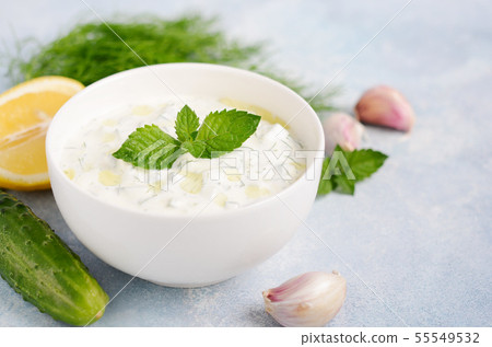 Greek dip sauce or dressing tzatziki. 55549532