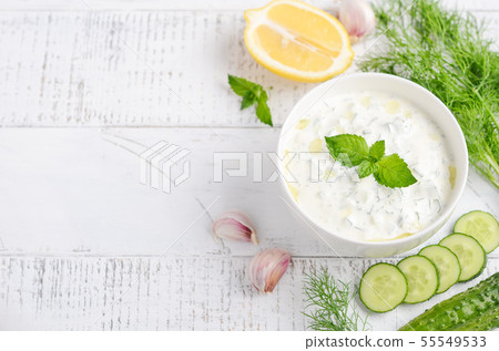 Greek dip sauce or dressing tzatziki. 55549533