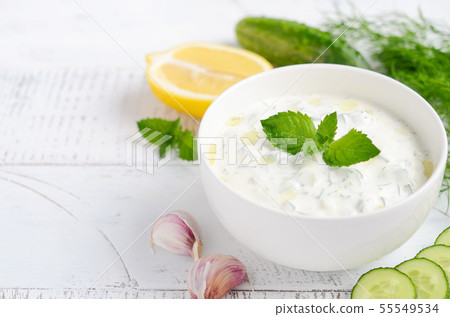 Greek dip sauce or dressing tzatziki. 55549534