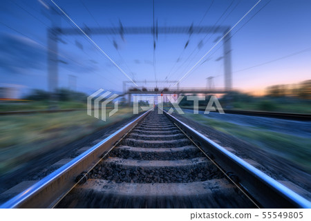 Railroad at dusk with motion blur effect 55549805