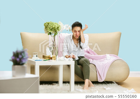 Young woman suffering from hausehold dust or seasonal allergy. Young woman suffering from hausehold dust or seasonal allergy. 55550160