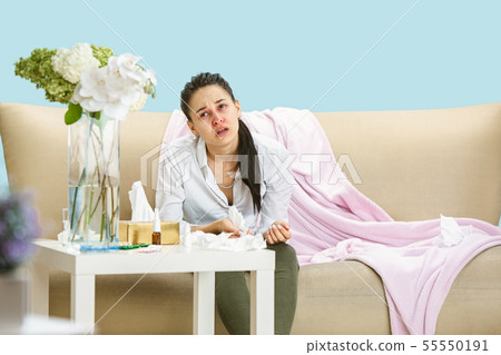 Young woman suffering from hausehold dust or seasonal allergy. Young woman suffering from hausehold dust or seasonal allergy. 55550191