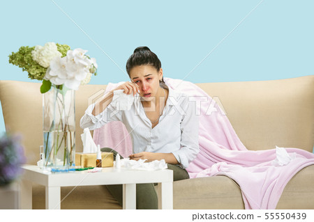 Young woman suffering from hausehold dust or seasonal allergy. 55550439