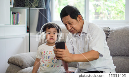 happy Grandfather and grandson Sharing smartphone happy Grandfather and grandson Sharing smartphone 55551405