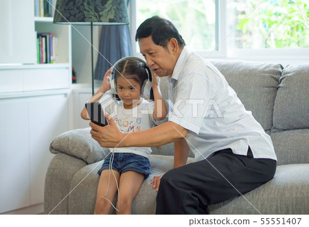 happy Grandfather and granddaughter Sharing 55551407