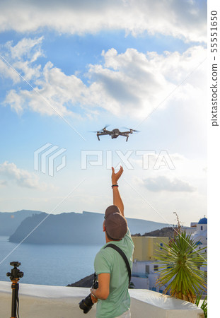 A traveler using drone A traveler using drone 55551650