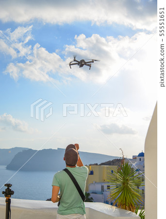 A traveler using drone 55551651