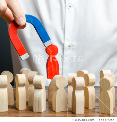 businessman pulls out a red figure of a man businessman pulls out a red figure of a man 55552062