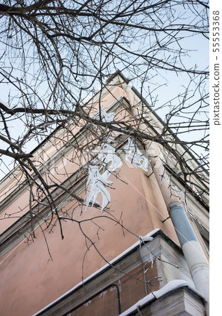 Icicles hang on bare tree branches Icicles hang on bare tree branches 55553368