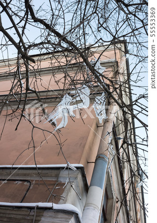 Dangerous icicles are on bare tree branches 55553369